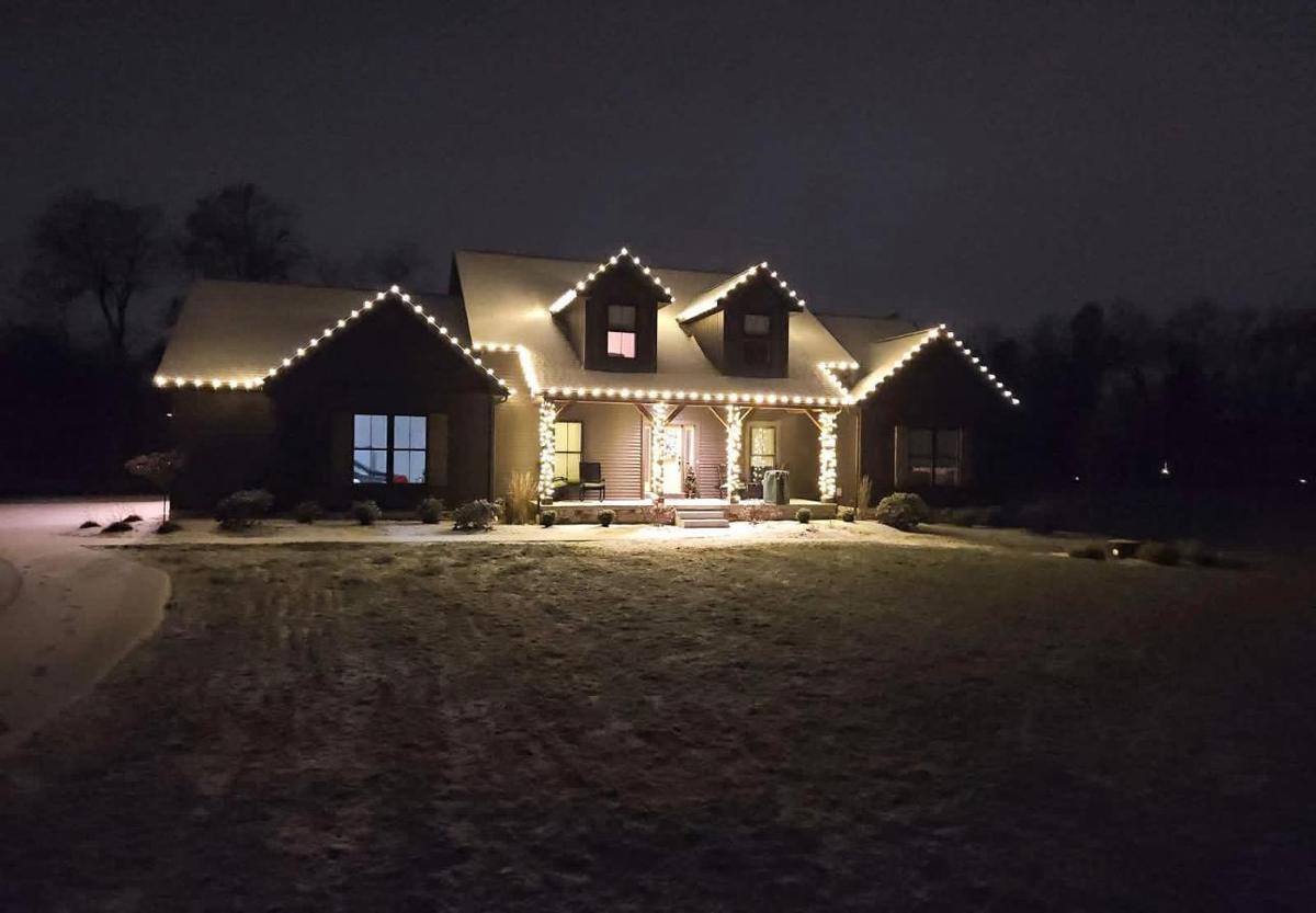 Cape Cod home with warm white roofline and gables